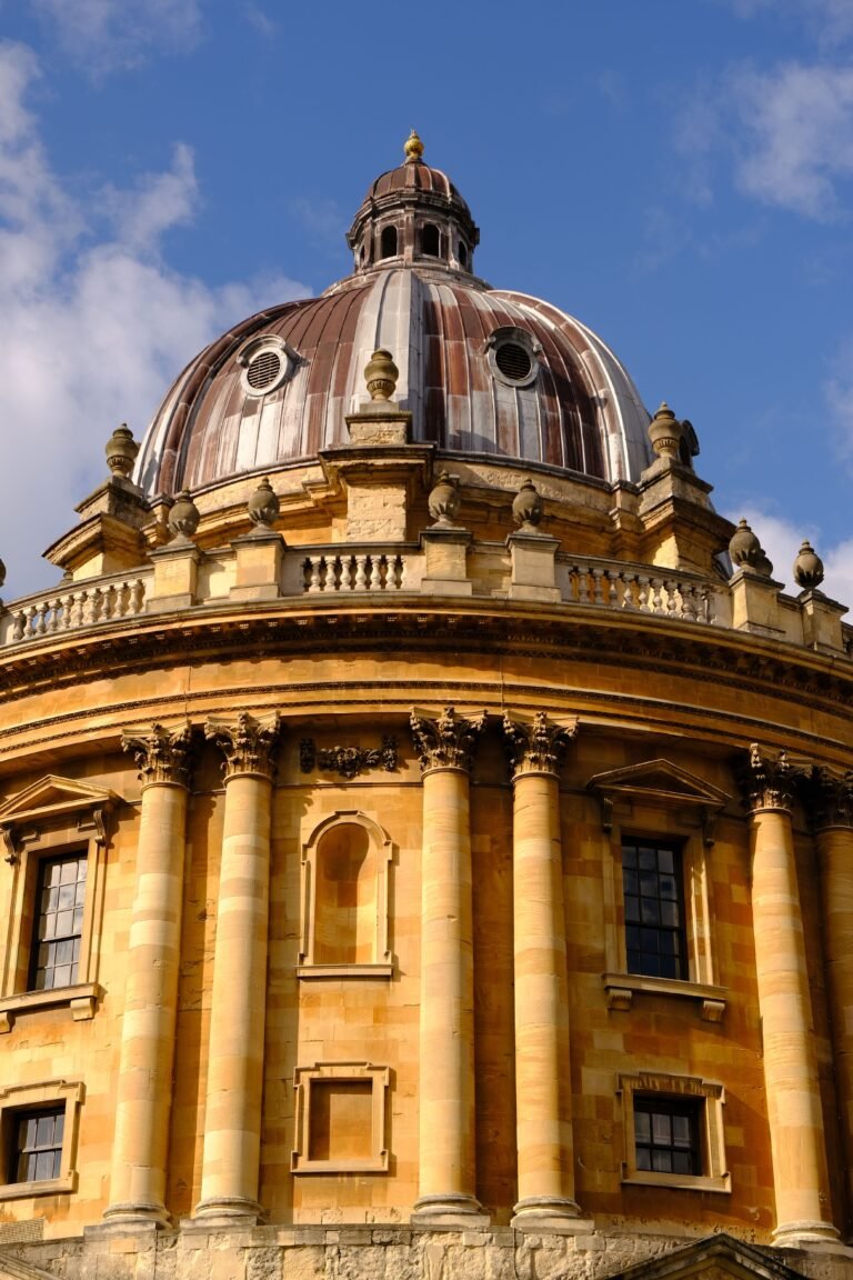 The dome and curved stone facade of the Radcliffe Camera in Oxford.