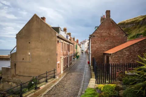 A cobbled residential street in Whitby